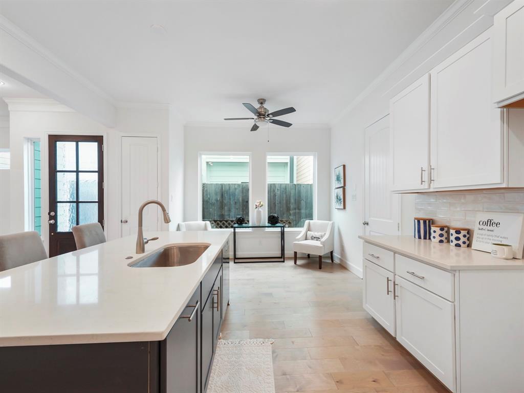 Step into a large and open kitchen, highlighted by the upgraded paint-grade cabinets, stunning quartz countertops, and stainless-steel appliances! (Appliances have been installed since photos were taken)