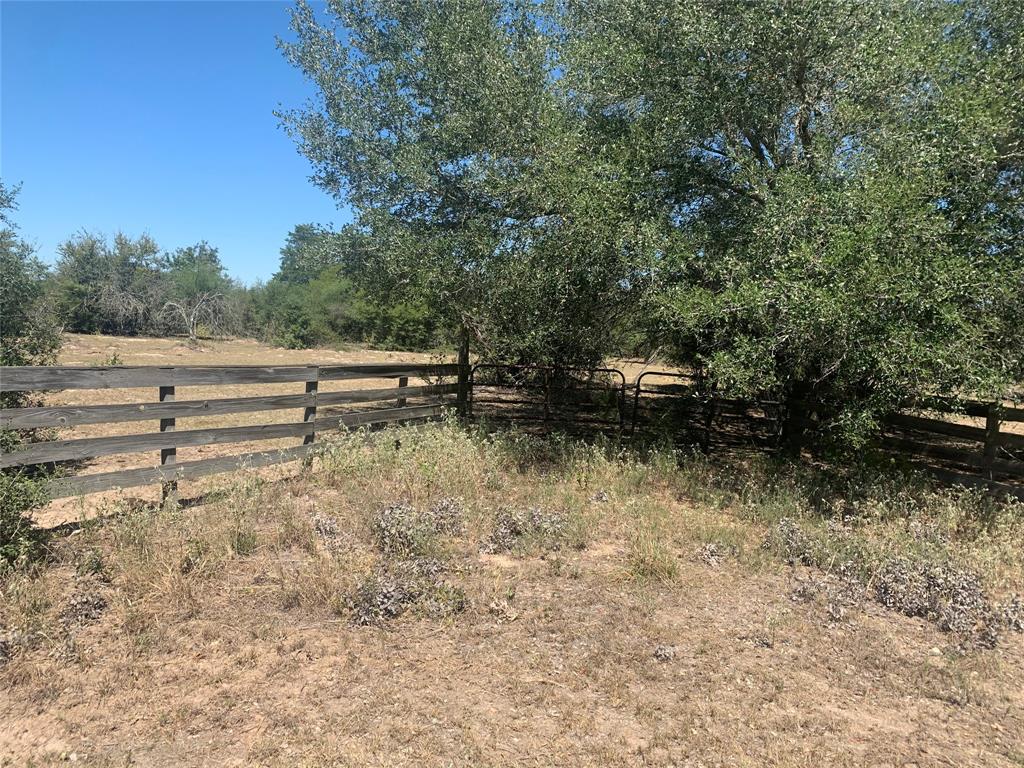 Nice wooded acreage close to Hallettsville.  Great area for a hunting, residence or recreational purposes. This tract is fenced and borders two sides of a county maintained  paved road.  There is a water well located on the property in need of repair.