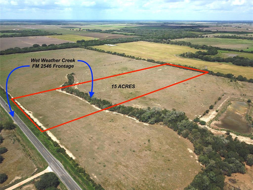 15 acres with FM 2546 frontage in the New Taiton area and less than 10 minutes north of El Campo. Cleared, level ag exempt property completely out of the flood zone! Wet weather creek runs through the middle of the property, providing a nice wooded barrier between the front and back. Quiet farming area with low traffic and beautiful wide open views. Excellent site for your home. Additional acreage available. Call today!