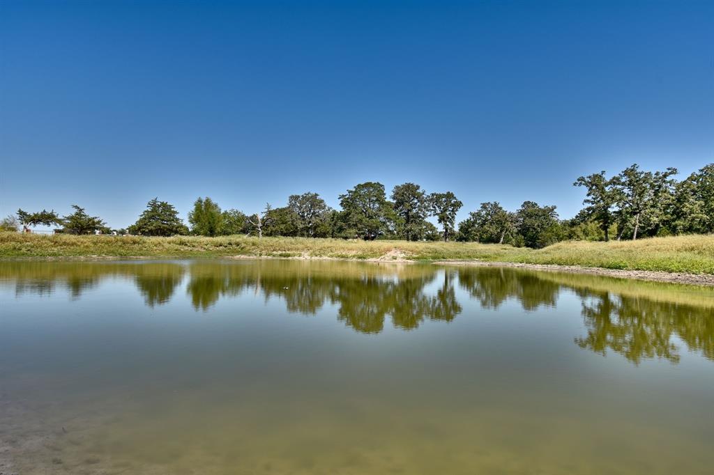 This incredible property has two ponds and the perfect place to build a home. There are mature oak trees covering the property. There is a barn and cabin on the property. If you're looking for a property for wildlife and a retreat, this is it! You have to see it in person to understand it's beauty!