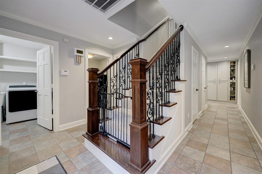 The staircase with intricate ironwork leads to the second floor with four exceptionally large bedrooms.