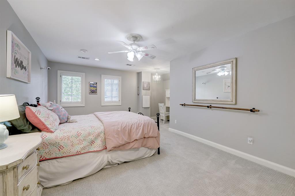The fourth bedroom overlooks the front yard, with plenty of space for a desk and a ballet bar.