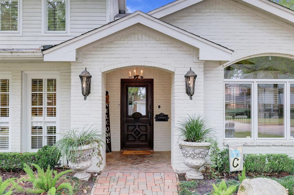 This classic covered front porch is a lovely welcome to guests!