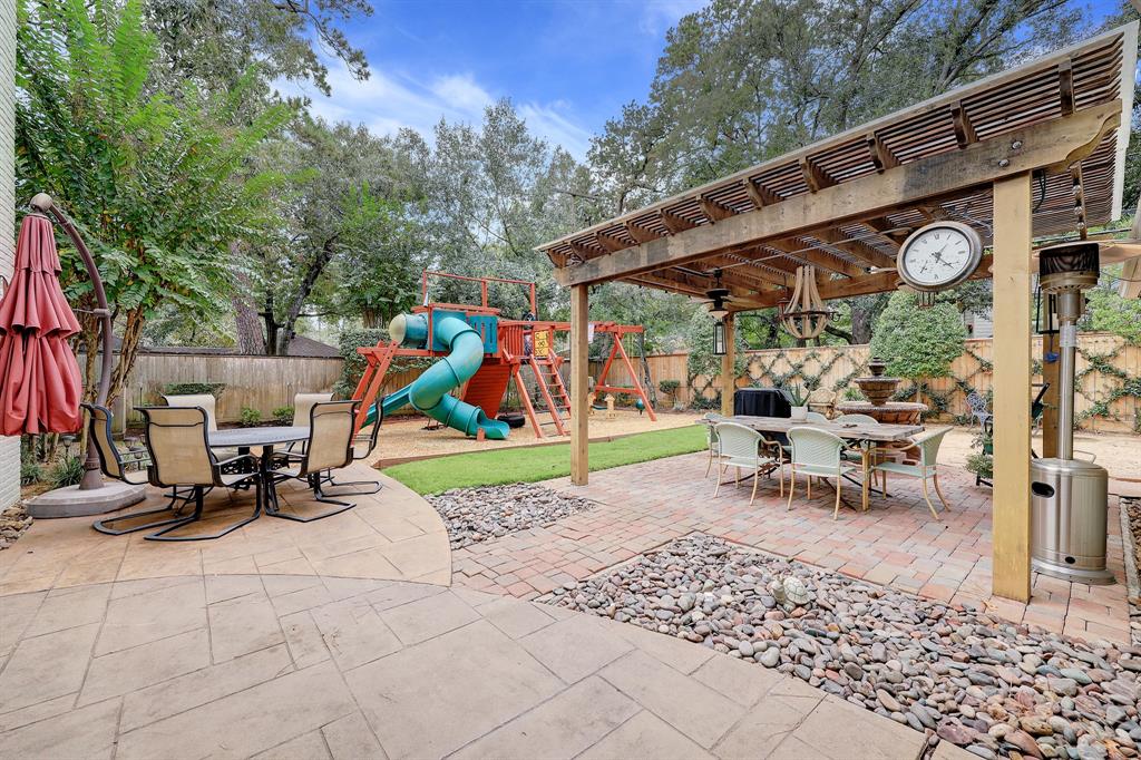 The large, well landscaped and private back yard is an absolute oasis! So much room for dining, relaxing and playing.