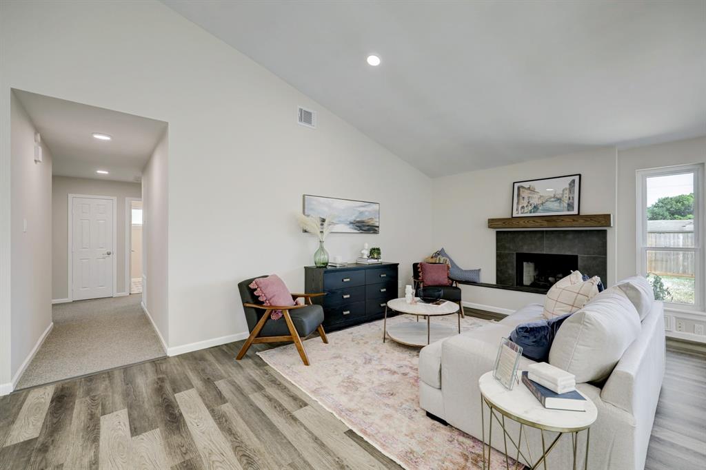 The family-room is an open space with a fireplace and back door access.