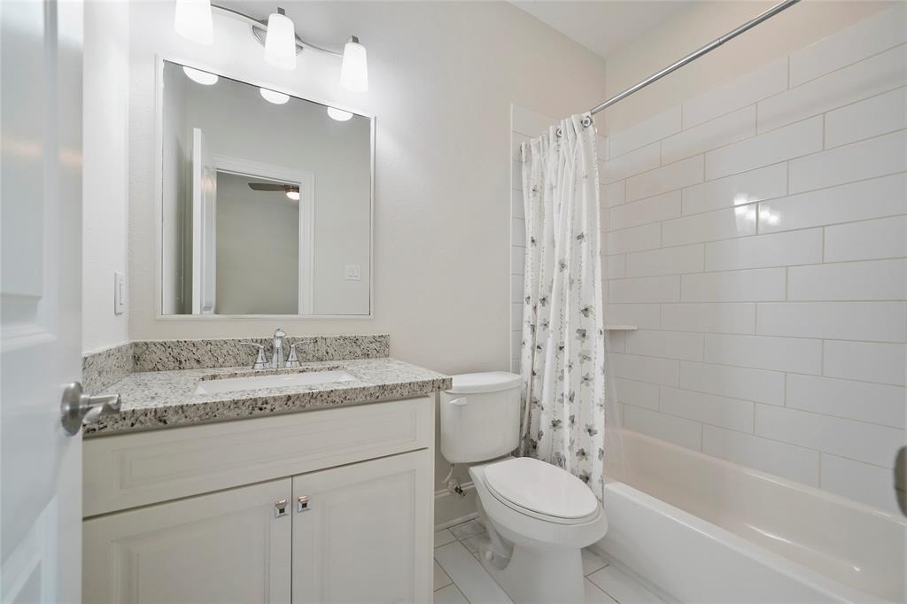 En-suite is located just off the downstairs bedroom includes granite counter tops and subway tile.