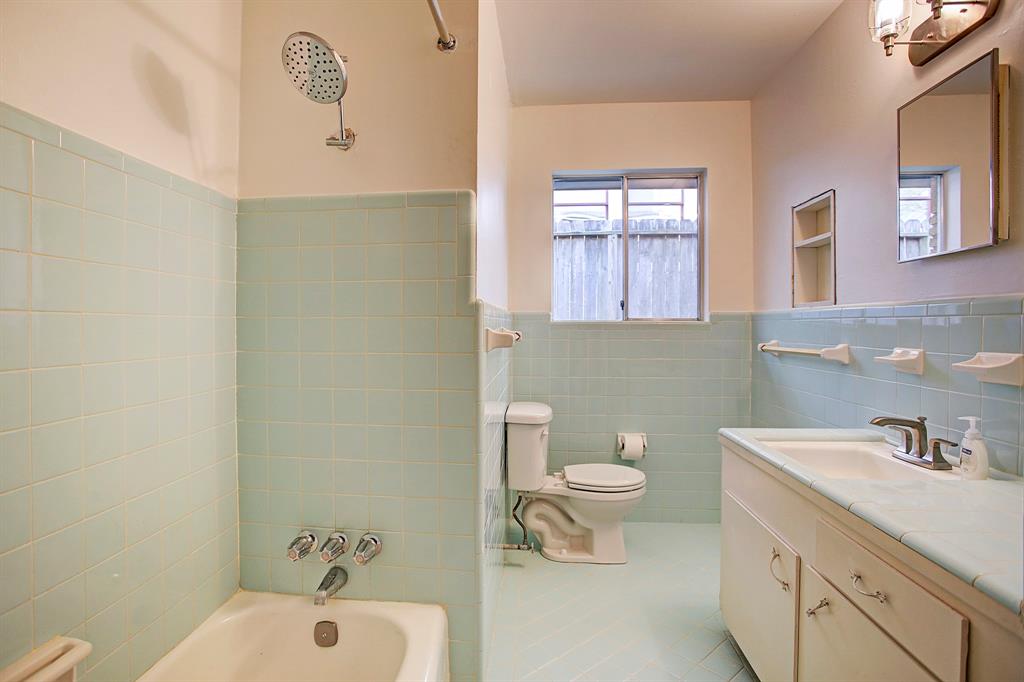 The full bath in the hall has natural light, great counter space and a combo tub/shower with oversized shower head.