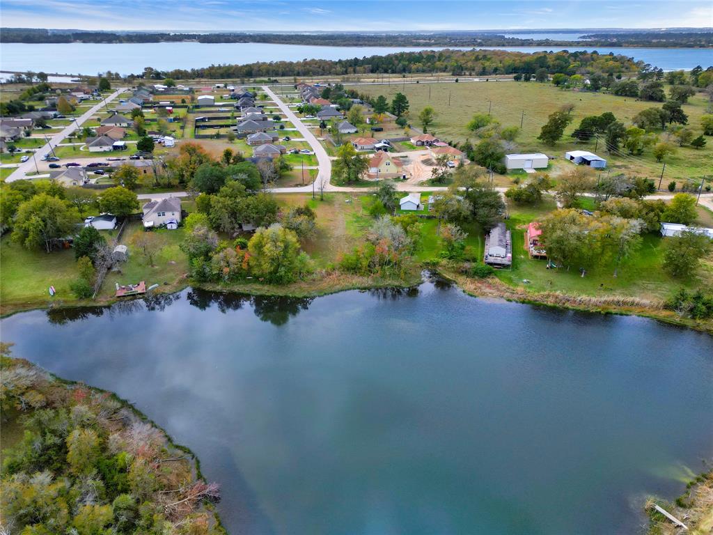 Beautiful Half acre lot sitting on a private 5-acre lake in the sought-after Willis ISD. Beau View is located down Longstreet on the West of I-45. Very close to Lake Conroe access. Water, Electric and Sewer are on site.