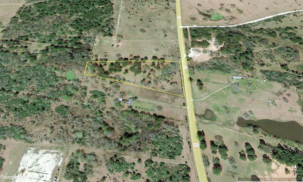 Beautiful, mostly level five acre tract with no floodplain per maps on file. Mix of tree clusters and cleared pasture. Located right on FM 247 for excellent access, perfect unrestricted property for a home, weekend getaway – whatever you can imagine.