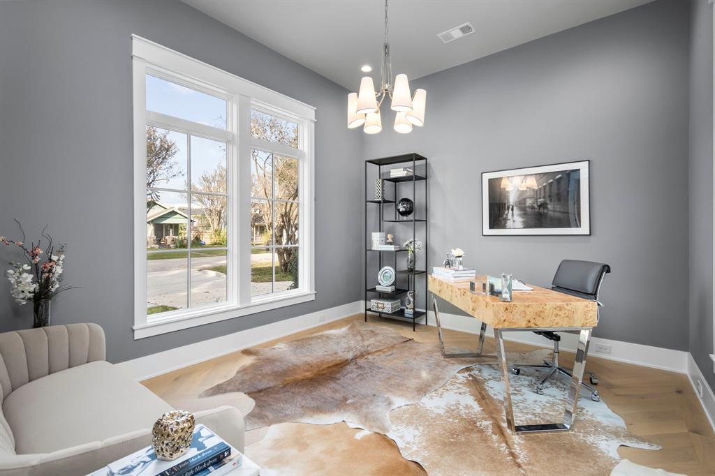 The 13 1/2' x 12' home office has dual windows, facing both north and south, which, combined with the 6-light chandelier and LED recessed can lighting, provide ample illumination for this room.