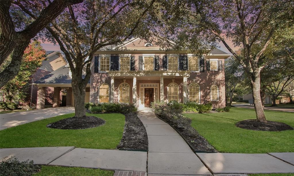 Welcome home to 11 Turtle Creek Manor! Plenty of room to relax on tiled front porch shaded by two mature trees!
