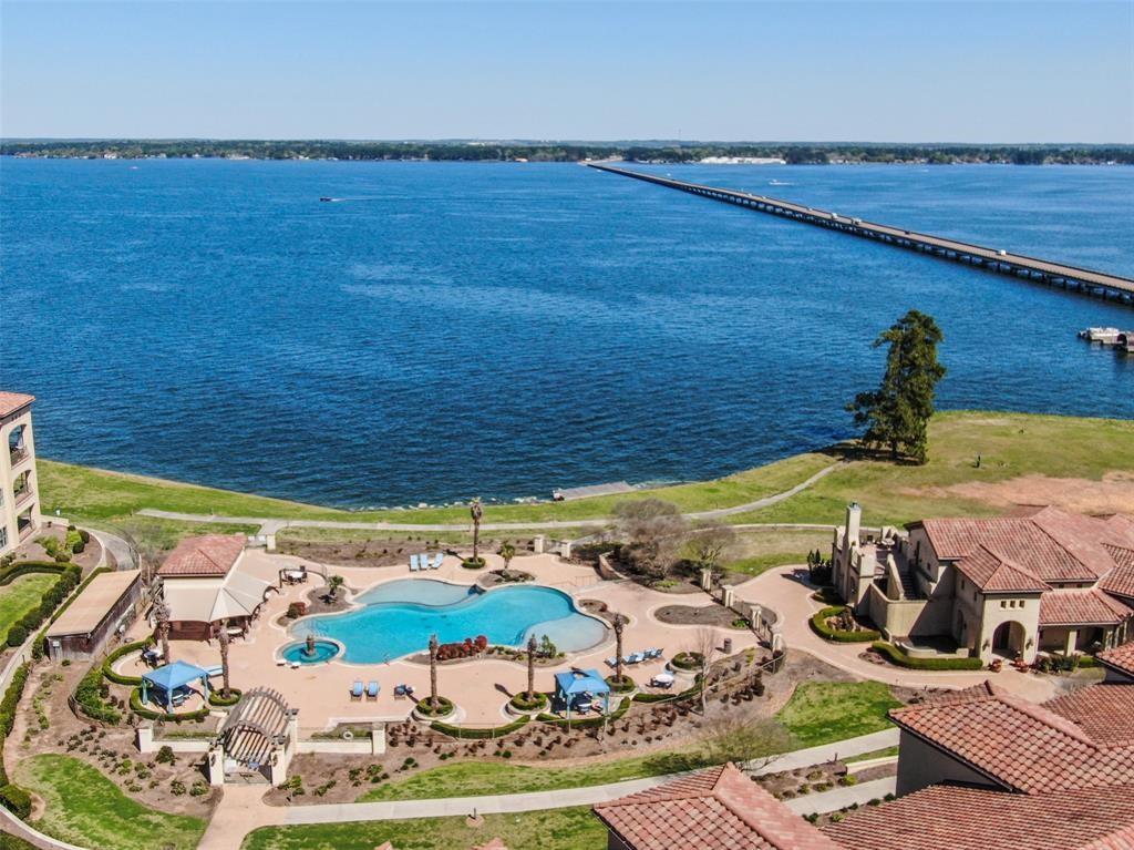 Beautiful waterfront condo located in Lake Conroe. This 2 bedroom 2 bath unit overlooks the Cabana club. 10' ceilings tile floors , granite countertops, and has its own balcony. Amenities include billiards room with athletic facility, large entertainment room, infinity pool and hot tub, fresh new paint, and flooring; Pavilion with BBQ area , Roof-top Deck, Outdoor Fireside living are with a lakeside porch. Come live on a retreat-like home!
