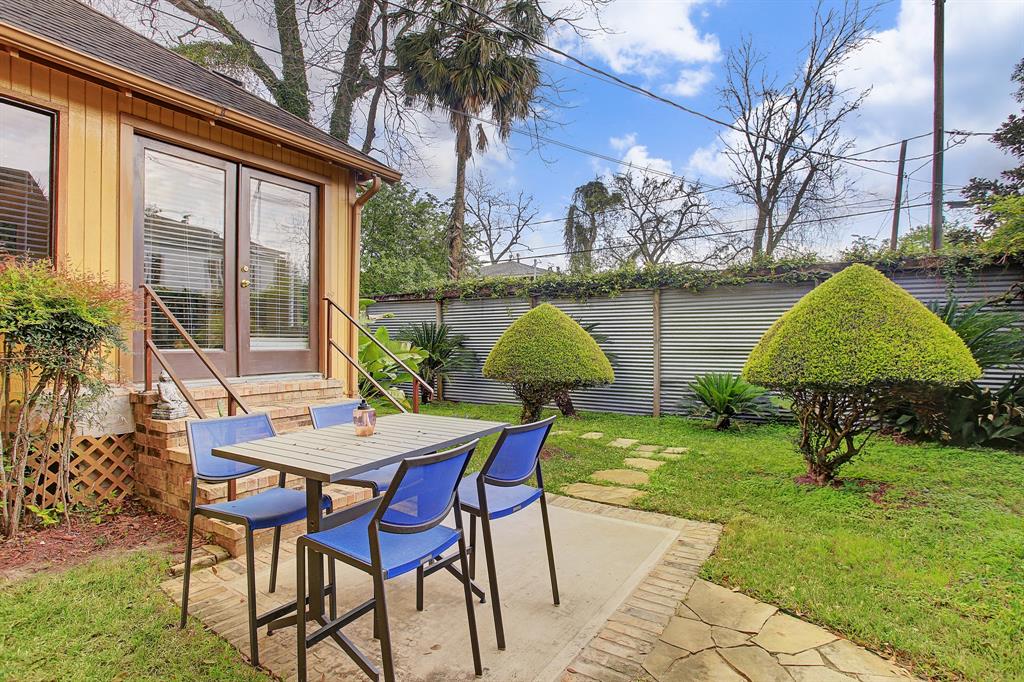 The very private back yard is landscaped and includes a patio for lounging or dining furniture.