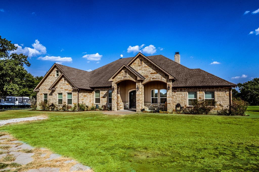 IT DOESN’T GET ANY BETTER than this 6 bed/5 bath home w/3 car garage on 12 acres. A crepe myrtle lined drive leads to a custom built home that is functional & stunning. Guests enter through stunning wrought iron doors & are welcomed into the immaculate home’s open layout. The gourmet kitchen is built for serious entertaining- features a 6 burner gas range w/griddle & 2 ovens, wall oven, dual refrigerators, built-in ice maker, custom cabinets, large island w/prep sink & walk in pantry. The ground level houses all 6 bedrooms, study & utility rm w/2 w/d connections. Primary bed features include a gas log fireplace, en-suite bathroom, soaking whirlpool tub & separate shower, dual vanities &abundant storage. Game room & fully equipped media room can be found on the 2nd floor. Outside you will find a picture perfect view from the sprawling covered patio w/outdoor kitchen. Watch daily visits from deer & other wildlife from the pergola or stone fire-pit. Shop & dog run have electric & water.
