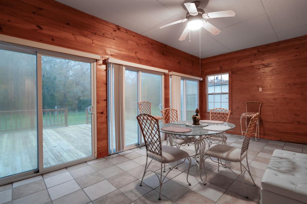 Back patio with large sliding doors. Open the doors that lead out to a expansive deck for indoor/outdoor living.