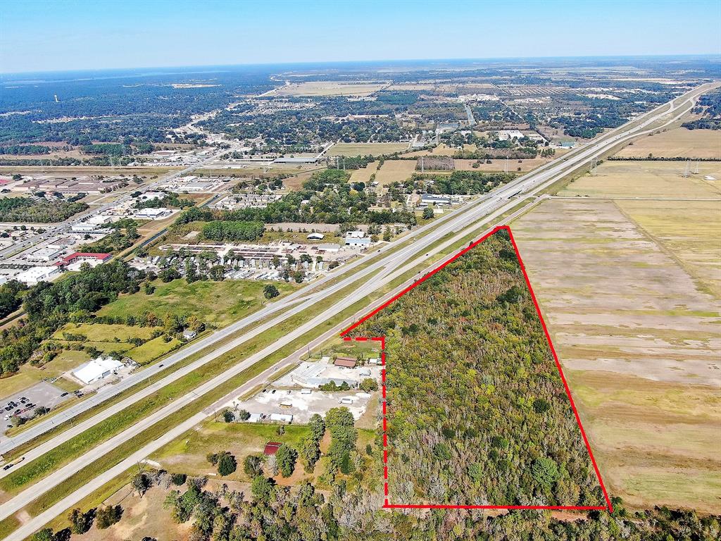 +/- 15.88 Acres located in Crosby just a mile north of FM 2100 and US Hwy 90.  Situated between Kennings and Krenek.  No restrictions or zoning.  Possibilities for Residential, Industrial, Multi-Family or Mixed-Use. Crosby MUD 50 provides water to neighboring areas.  +/- 592 SF frontage on US Hwy 90.  Located near schools, restaurants, shopping centers with residential housing nearby. Will not divide.