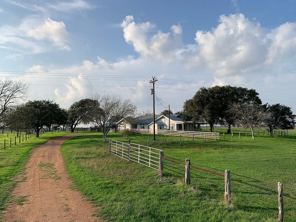 81.35 Acres on a hill top with nice views located between Moulton, Flatonia and Praha. Pasture land with cross fencing, a barn/shop and a cattle barn with working pens, and 2 Ponds. 3 BR, 2 BA farm house with ample square footage being 2480 Sq.Ft. per LCAD. 576 Sq.Ft. attached garage per LCAD. Spacious floor plan with large living area and kitchen. Large laundry room and additional room for office, BR, or storage. Attached garage with open front porch. Central A/C and Heat. The house could use some upgrades and repairs, a little TLC would go a long way with this home.