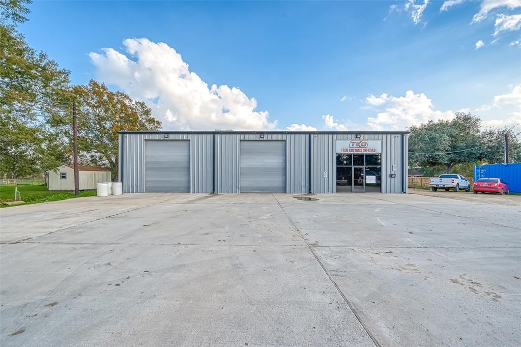 Great opportunity to own this unique property with almost 300 ft of frontage rd.  Conveniently located just 3 miles off of 59.  There is no other location like this one that you will find.  Main building has a large shop with overhead doors for easy access for tall equipment needing to be moved inside and out.  There is also a single family home with 1 acre of land that is being sold within the sale of this property.  2 small business renting out the smaller building in the photos as well.  Call now for your private tour of this unique property.
