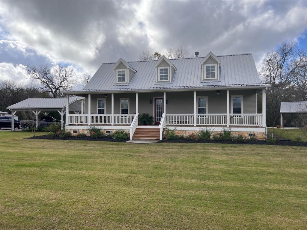 Beautiful farm house on 18 acres in Wharton County. The home sits on the banks of beautiful Peach Creek and looks out onto the 19 acres of rich, fertile Peach Creek soil suitable for grazing and/or hay production. The home features wood-look luxury vinyl planking, granite countertops, large front and back porches and many other modern features. There is a large 60'x48' barn and a 36'x24' shed on the property. The barn includes an enclosed 24'x12' storage room and a 24'x12' office. In the backyard you will find a beautiful swimming pool and pavilion area perfect for family entertaining. The home includes a Culligan water softener and filter system. If you are looking for a secluded, beautiful place in the country with some acreage, barns, pool and more, this place might be just what you are looking for,,,and only 38 minutes from Sugar Land! Make your showing appointment today!