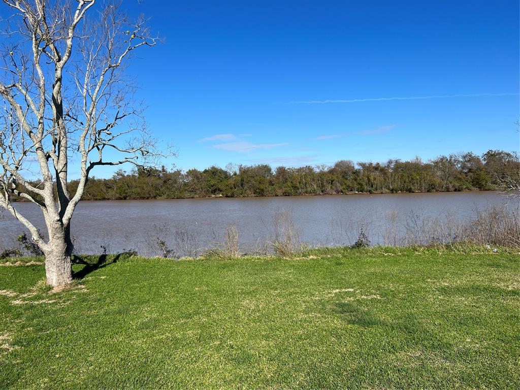 Physical Property Description:      
Beautiful, wide open .85 acres on the Brazos River near the Freeport Golf Course!! It is a quiet country setting with almost no neighbors! City water and sewer! It is very rare to be able to buy land on the Brazos River! Great fishing, boating, swimming, kayaking, or just enjoying the views! Only a few miles by boat to the Gulf!  Brazos Mall is 10 miles away, Surfside Beach is 12 miles away. Road frontage 108 feet, River frontage 111 feet! This land will be snatched up quickly so don't hesitate! Do Not drive on the property - the land is smooth for mowing, and the owners do not want ruts in the land.