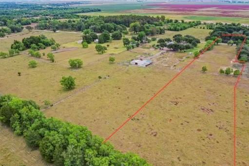 6.48 +/- UNRESTRICTED ACRES await you down Hopkins Lane in rural Damon, Texas.  The land is comprised of native pasture with coastal grasses that have supported livestock for years.  The property is 3/4 fenced with power in close proximity to build your dream farmhouse or barndominium on; with enough room to let your animals roam freely.  Conveniently located in NW Brazoria County, only 12 minutes to Hwy 35, 40 minutes to Houston, or 45 minutes to the Gulf of Mexico.  Call for a tour today before this peaceful country tract is gone!
