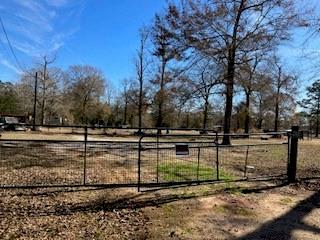 This 3.65 acre tract has already had all the hard work done with the land having been cleared and partially fenced.  It has a Hoot Aerobic system, electric and water in place. It is located in the rural Shepherd ISD school system. Bring your mobile home or build your dream home on this quiet country location. (Sellers are in the process of removing the clutter.) Please verify all information.