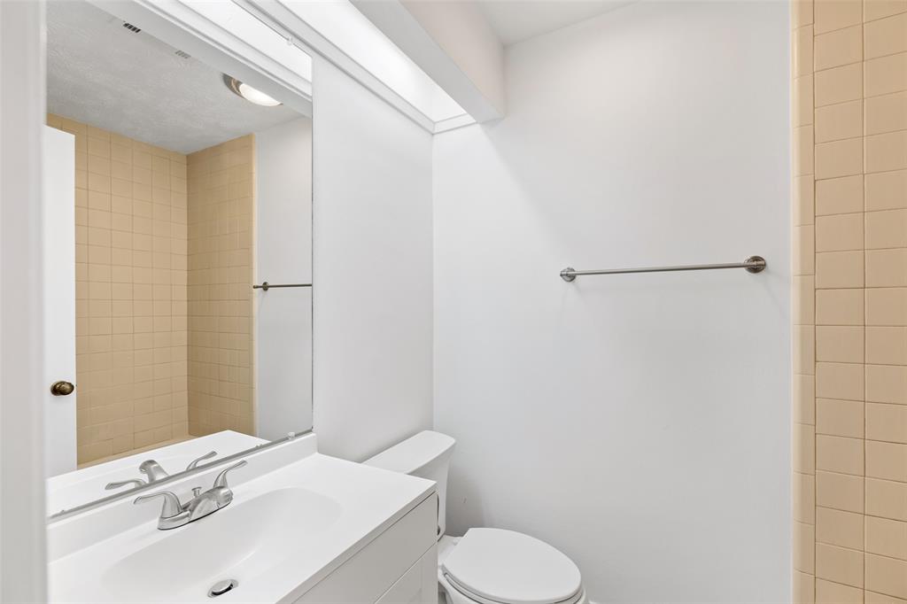 This secondary bathroom is located right off the secondary bedroom and includes a shower/bath combo.
