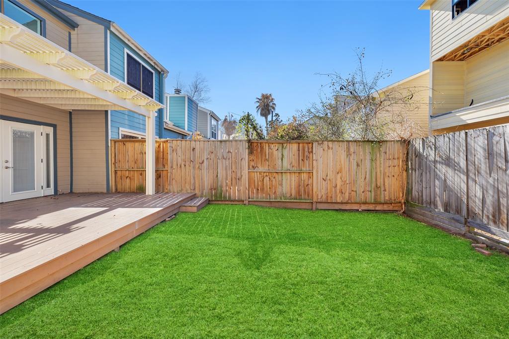 The backyard and large wood deck are highlights of this great townhome. Per the seller, the deck and pergola were installed in 2020. Dogs and kids are going to love running around the backyard.