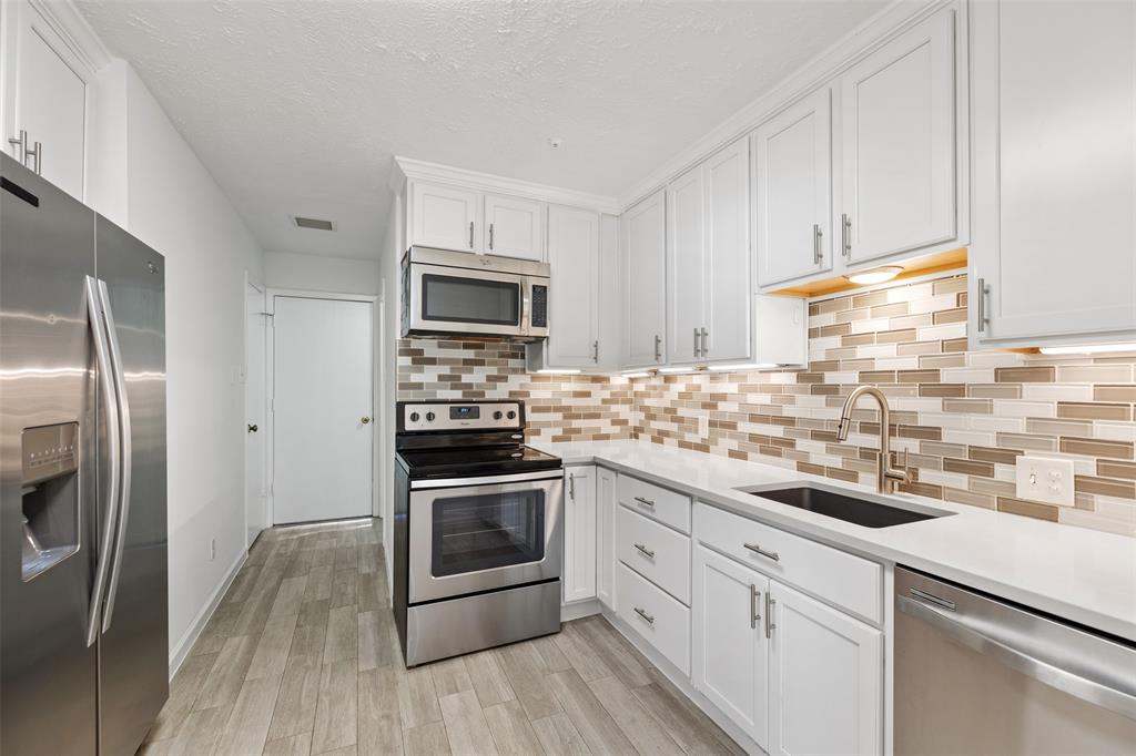 Per the seller, the kitchen was updated in 2018. Updates include stainless steel appliances, tile floors, a large, single basin under cabinet sink, a single hole faucet with pull down sprayer, and gorgeous quartz counter-tops.
