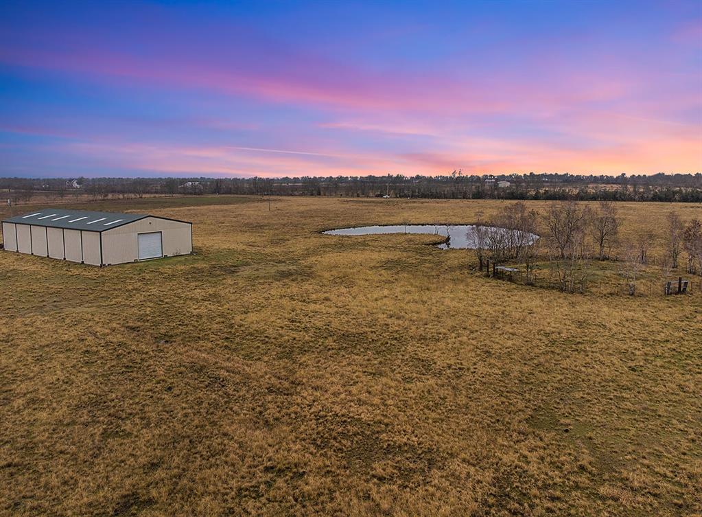 The most beautiful peaceful sunsets can be found right here and wildlife roaming freely to see! Create your own 7200 sq ft barndominium, RV park, subdivision, tiny home community, NO RESTRICTIONS! Electrical, water well, and corral pin found on this piece of prime property. Don't forget both of the ponds for fishing while watching those sunsets every night too! Gravel road to be paved with easy access to and from State Highway 288. Call for your personal tour today and get the full gorgeous 45.66 acre experience to take it all in!