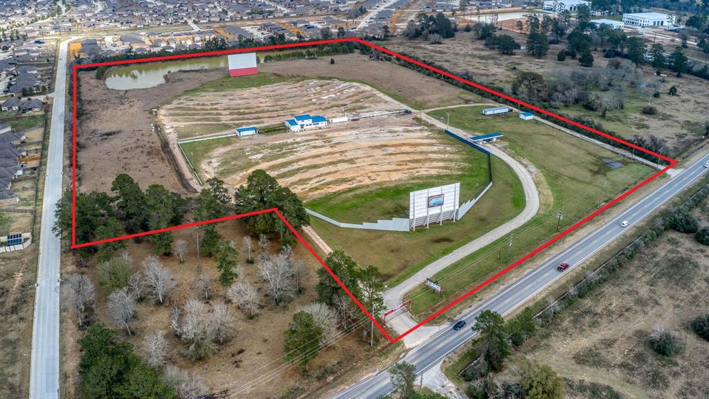 31.6 UNRESTRICTED ACRES! Property sits in a fast growing area on FM 2920 surrounded by new subdivisions. 708' of road frontage on busy FM 2920. Property is currently set up as Drive-In theatre including concession building, restrooms, ticket booth, 2 large screens, 20x20 garage & supply container. Convenience store planned for corner beside subject property. Area is ripe for development!