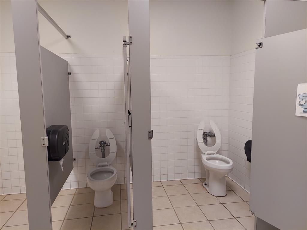 Ladies bathroom includes 6 stalls & sink. Approx. 22x14
