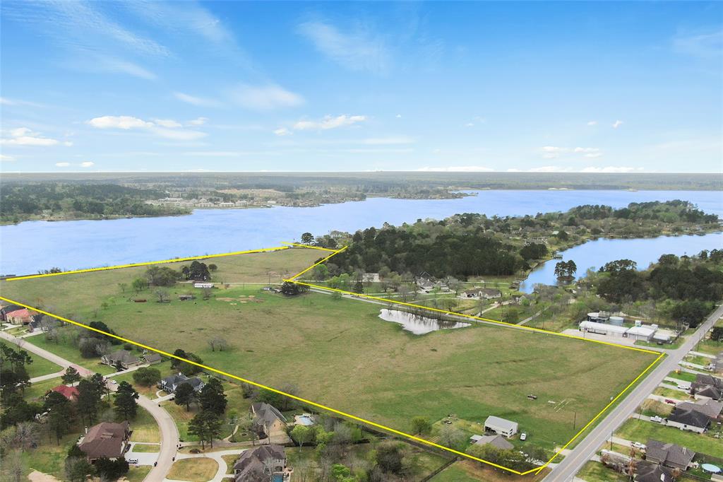 Opportunity is knocking:  47.354 +/- acres of unrestricted land on Lake Conroe with over 1,300 feet of shoreline. Located on Cude Cemetery Road (next to French Quarter and Lake Breeze Subdivisions) and Bruce Rd (across the street from Far Hills UD and Shelter Bay Estates) with AMAZING views of the calm & deep waters of Lake Conroe. Low tax rate of 1.98, water/sewer availability, no flooding, flat and buildable land, very easy access to I-45, all schools (Willis ISD - Turner Elem, Brabham Middle, Willis HS) and shopping/Golf Courses/boat launches/restaurants etc.. Frontage information: 768 ft on Cude Cemetery, 2,277 ft on Bruce, 1,307 ft on Lake Conroe (+/-)