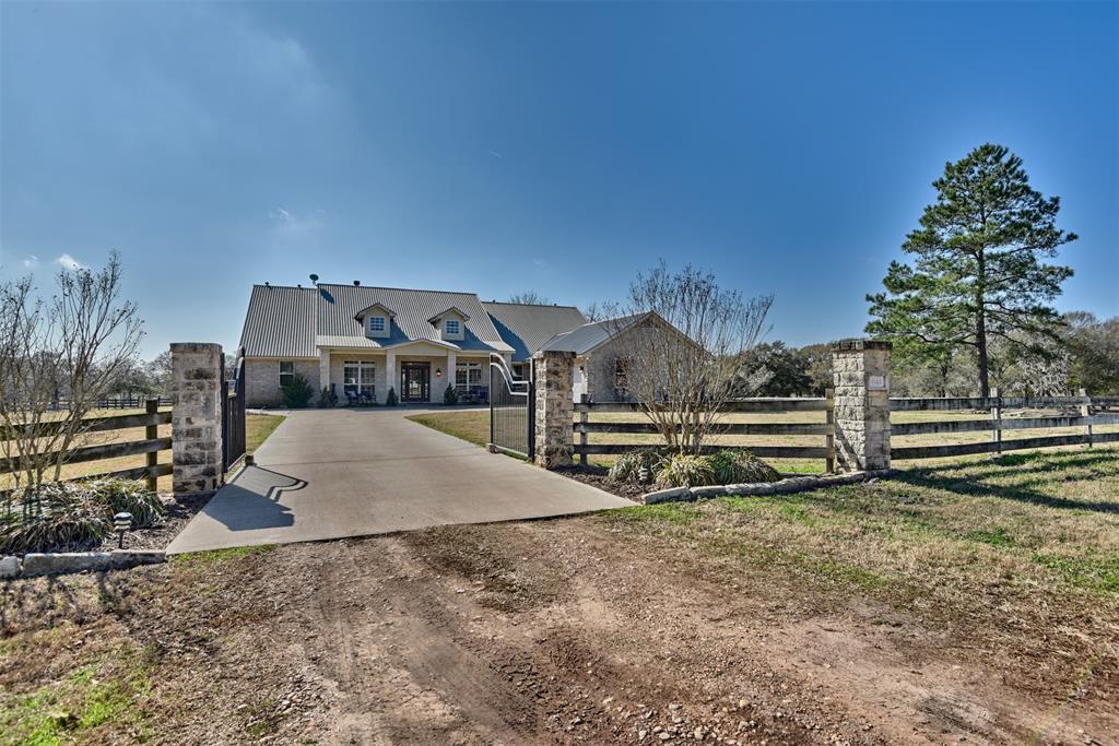 Home in Austin County, just minutes from the small town of Bellville's amenities and hospitality. The 3,479 sq. ft. residence was designed to make you feel right at home. On the interior there is 3 bedrooms, 3.5 baths, kitchen with breakfast area, dining room, game room/office and 2 spacious living rooms. Bonus extras 2 fire places, butlers pantry, security system, granite counter tops, stainless appliances, wet bar, large closets for storage, gated entrance, attached garage, covered patio and pool.  Navigating the properties 13 acres you will find that there is an excellent mix of outdoor recreational activities, agriculture opportunities and scenic views. Perimeter is fenced as well as a separate fenced pasture and barn which is ideal size for horses or future 4-H projects.  The partially wooded terrain and pond lends to the variety of wildlife. Approximately 1 hour from Houston is your opportunity to own a  move-in-ready home in a peaceful country setting that is unmatched.