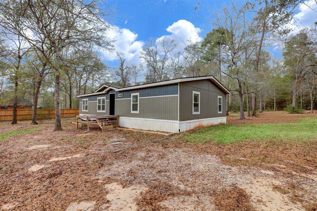 Beautiful 1.708 acre tract has it all - live on site and generate extra income! Lots of open space to relax and play, but partially wooded with nice mix of hardwoods. The main home is a spacious 4 bed, 2 bath, built in 2020. Upon entering the home, you'll be greeted by a large open concept living / dining / kitchen area, perfect for entertaining or hanging out with the family. Kitchen has large island, plenty of counter and cabinet space and modern farmhouse finishes. Primary bedroom is conveniently located off the living area with en-suite bath, featuring double vanities, soaking tub, walk-in shower and walk-in closet. Game room is located on the other side of the home, adjacent to the secondary bedrooms. Large utility room is in house. Guest home is in front of the property - a perfect income generator! Home has a living area in front with loft above, plus full kitchen and bathroom. There's also a large storage shed for all your tools and toys! Don't miss this incredible opportunity!
