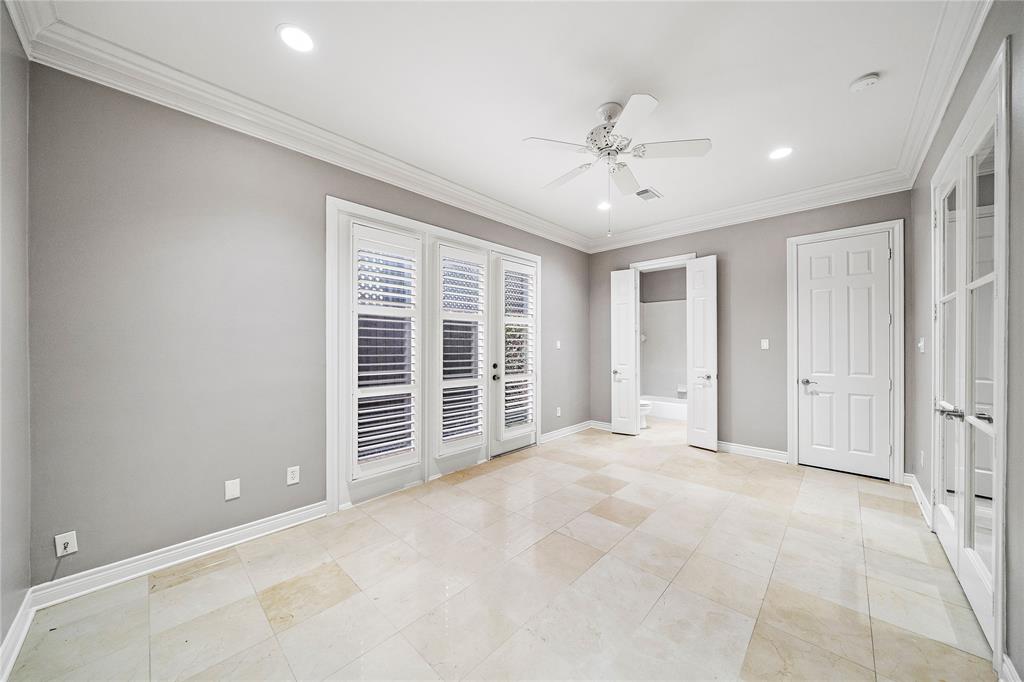 Plenty of possibilities await in this first-floor secondary bedroom, featuring ample space for a large-sized bed and seating area while leaving plenty of room to move around.