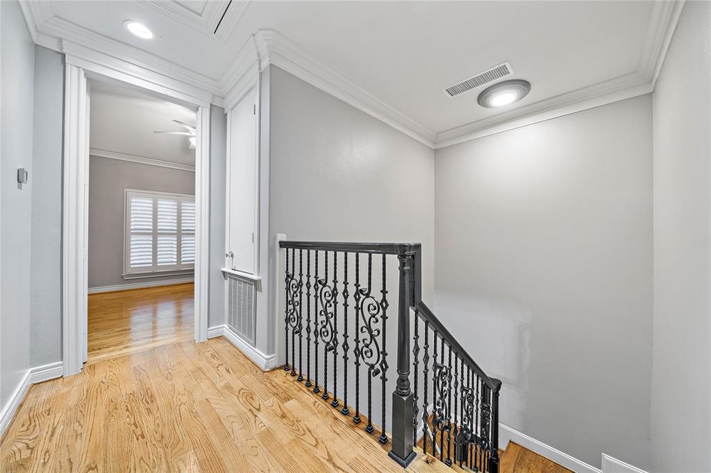 Highlighting rest and comfort, the third-floor houses two spacious bedrooms each with its ensuite bath. Notice the elegant staircase, accented with engineered wood flooring and intricate wrought-iron railings.