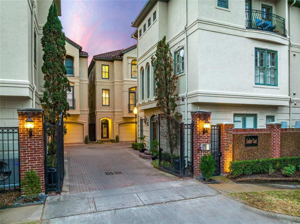 Brick pavers adorn the tree-lined gates and streets of the neighborhood, with brightly-lit corners providing an inviting ambiance for residents and visitors alike.