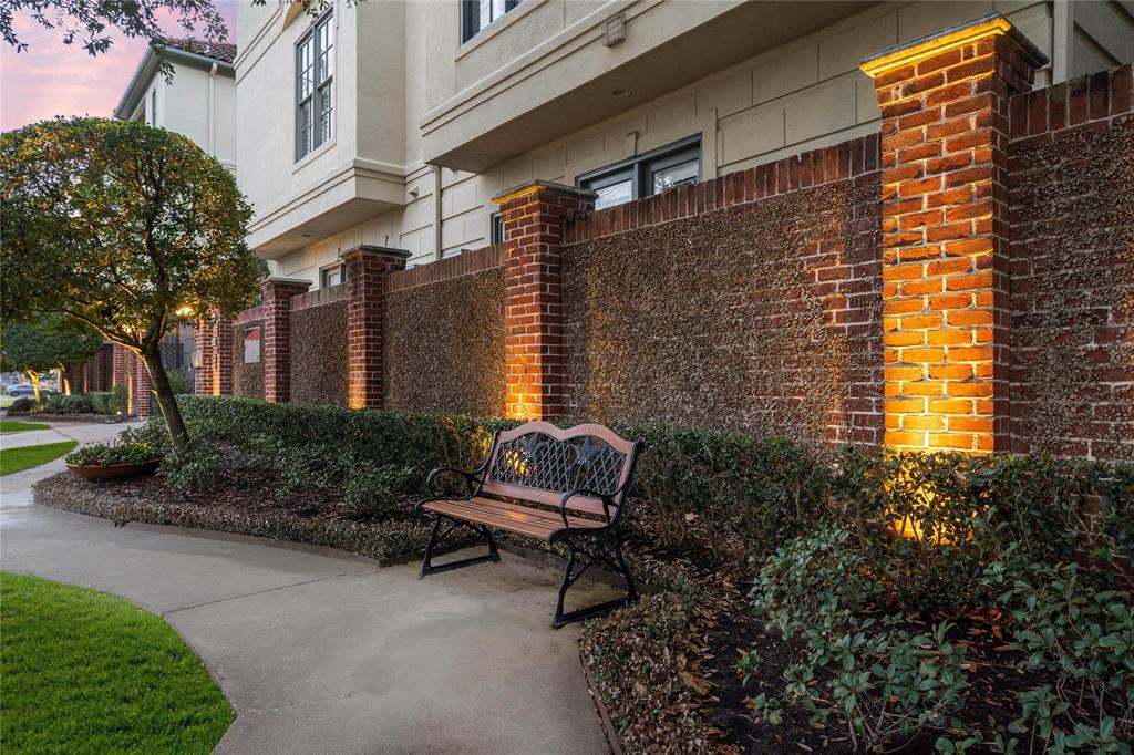 A beautifully-landscaped exterior greets you in front of Haddon Court, with a charming seating area inviting visitors to relax and enjoy the parkside view.