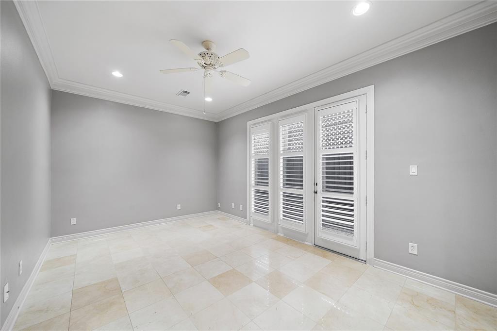 The first-floor bedroom is bright and open, ideal for a dedicated workspace. Enjoy direct access to the fully fenced patio/deck, a spot made for unwinding or enjoying personal downtime.