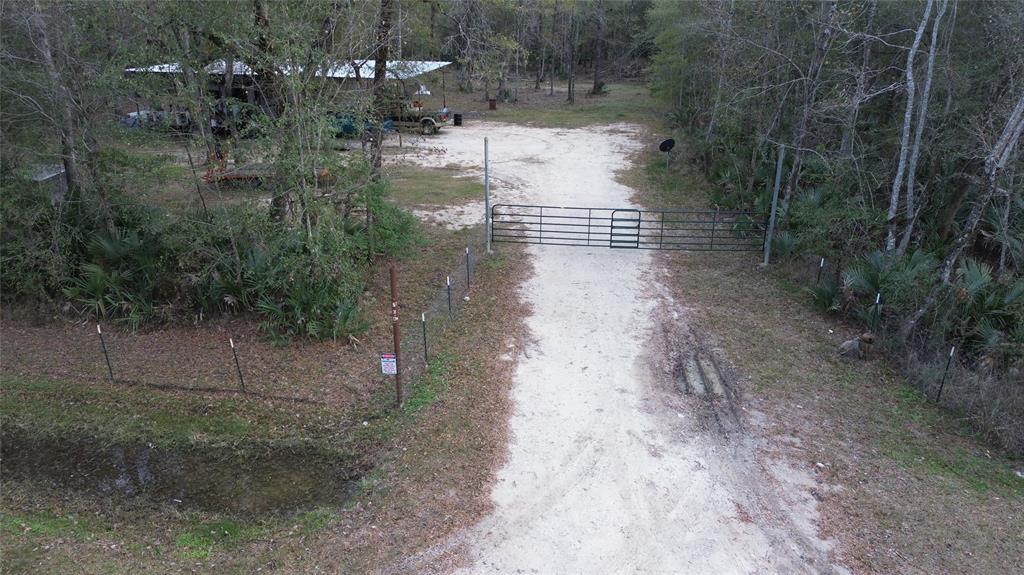 RV IS NOT INCLUDED IN THE SALE. LAND WITH 10 ACRES, COVER CARPORT AND A 2ND WILL BE COMPLETED BEFORE CLOSING(SEE IMAGES) READY TO BUILD YOUR DREAM HOME, PLENTY OF SPACE FOR YOUR GATHERINGS. NO RESTRICTIONS. BUYER TO VERIFY ALL INFORMATION.