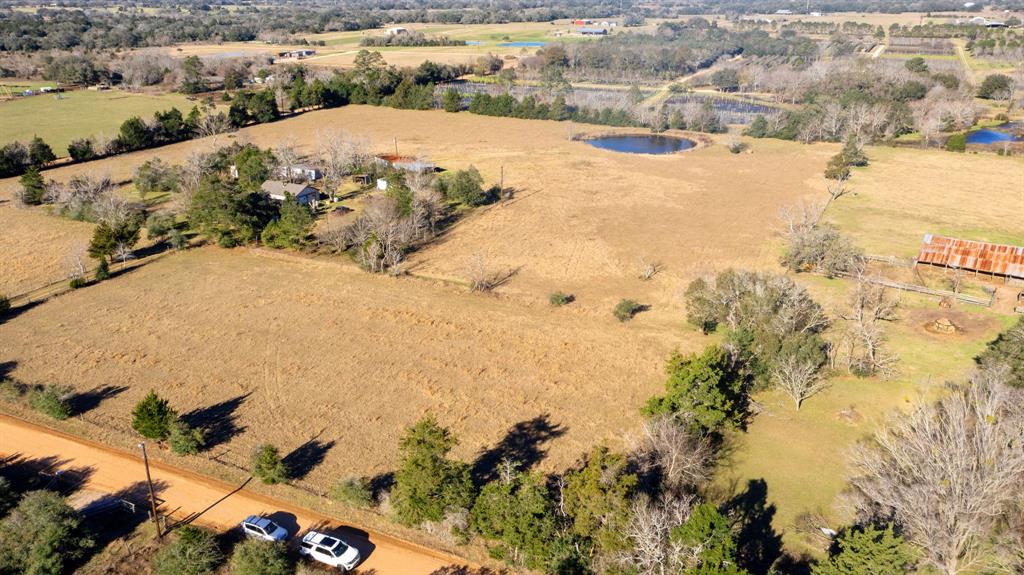 Very Rare Small Acreage of +/- 3.297 Light Restricted Raw Land Located In Cat Spring TX, Just Minutes From IH-10 and Columbus, Tx.  This Land Is Ready For Your Dream Home or Barndominium On This Quiet County Road. This Small Tract Includes A Shared Pond Ready For You And Your Fishing Pole... Properties this size in this area do not become available very often!   Property is being divided off of a larger tract and fenced by buyers.  ** Light Restrictions- No Visible Commerical Businesses, No Mobile Homes, Single Family/ Not to be subdivided, No Firearm Hunting
