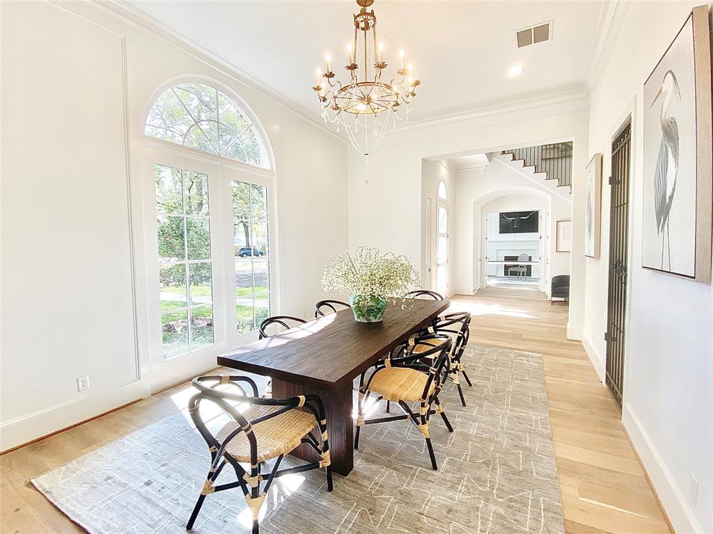 A sunfilled majestic dining room awaits your formal occasions  Beautiful wide plank hardwoods are among our standard features as shown in this previously sold home.