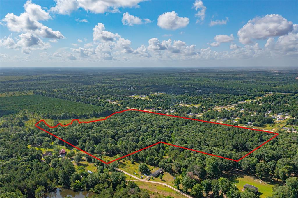 Just look at this amazing property tucked away in Cleveland, TX. There are 3 lots combined totaling 33.4 acres.  There is also a section of the property that has high fencing going around it. You have plenty of trails to ride through with endless possibilities.This property won't last long call now! No restrictions, No HOA, come ready with your dreams!