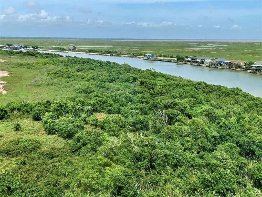 Island property on Matagorda Bay and the Colorado River!

Three R Island is comprised of two tracts (1,568 acres and 187 acres) equaling approximately 1,755 acres, to be surveyed, located between the Colorado River and Matagorda Bay on the Texas Gulf Coast. This is quite a unique offering that is across the river from the established fishing cabins and restaurant along Beach Road. It is land locked from vehicle use roads, but easily accessed by boat for transporting building materials, etc. by crossing the river at the public boat launch. The property itself varies from solid grassy and brushy areas well above sea level to marshy bird habitat and estuaries.  The 1568 acres is water/boat/helicopter access only.  There is no electricity or water on the property.  
The south tract of 187 acres fronts Beach Road to the East, and is mostly marshy land. See map.