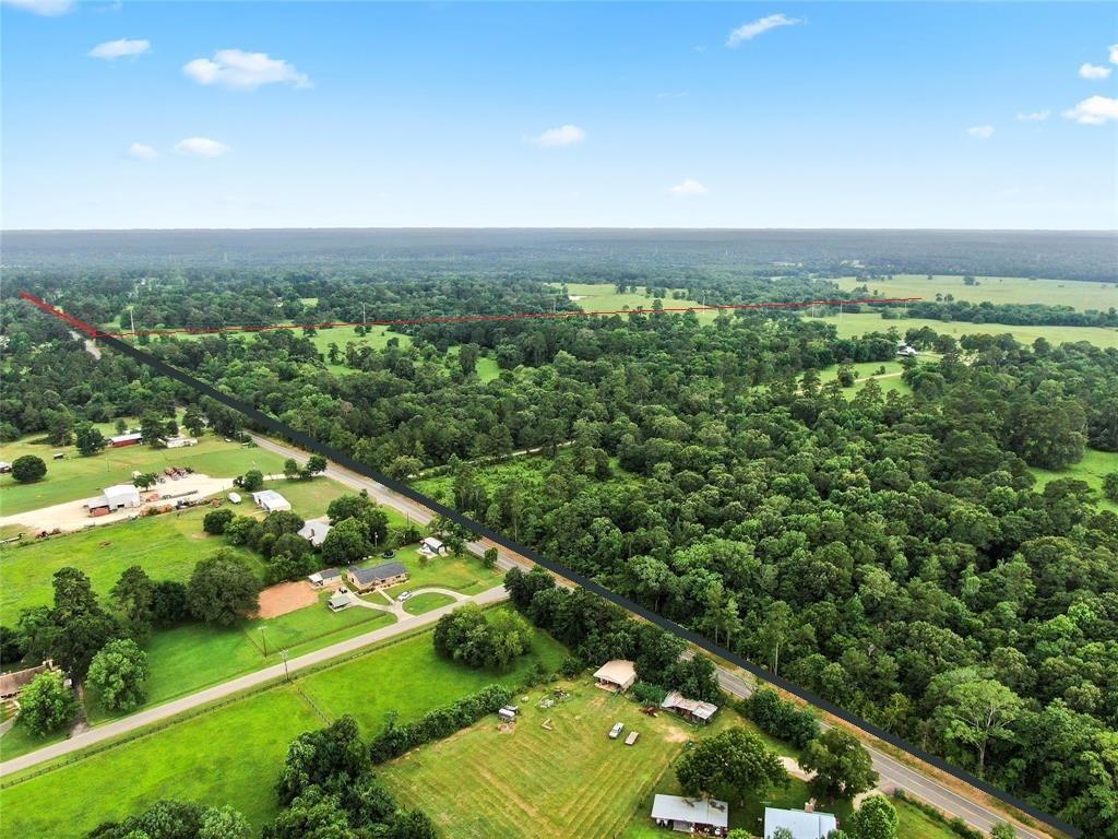 One of the LAST remaining 540 acre tracts (subdivided out of a 798 +/- acres larger tract) in Montgomery County that is untouched by development but perfectly preserved by Nature & maintained by years of knowledge & ownership. Located 4 miles from Hwy 105, 20 Miles to Interstate 45, 50 Miles to College Station and Houston. With almost 1,100 ft of County maintained road frontage, this prime piece of Texas Real Estate has so many possibilities. The elevation changes are one-of-a-kind and have to be seen to truly appreciate the beauty, opportunity and future of this land. The property is fenced, x-fenced, ag exempt, livestock ready, healthy ponds/tanks throughout the acreage, portions of the West boundary meander along the sandy banks of Lake Creek offering enjoyment for nature/livestock and owners alike. Development potential, multi-family ranch, secluded getaway or mixed use land; the possibilities are endless.