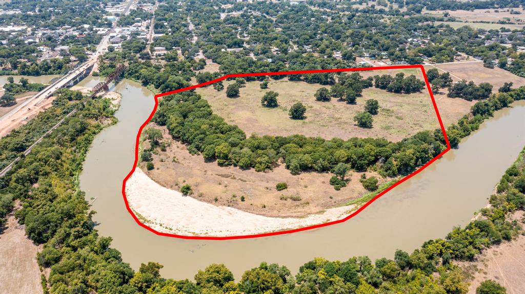 RIVER FRONT Property!!!  Ag exempt in Columbus TX.  Would make a beautiful home site or recreational property. Views of river bridges!  Stunning property with lots of potential.   The river curves around the property and this side of the river grows with natural dirt movement adding to the acreage over time.  Most of the property is FEMA zoned AE but there is a portion in zone X. All information to be verified by the buyer.