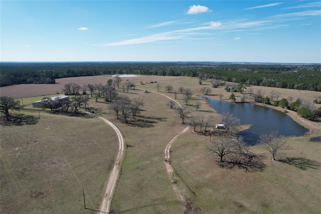 BEAUTIFUL RANCH!
 This 143.280-acre tract has so much to offer! The large ranch-style home sits on a hill overlooking a beautiful lake that is stocked with fish. You’ll appreciate the pretty pasture and excellent coastal hay meadow. The current owner reports an abundant hay production. There is also a bonus lake in the back that you can see from the side porch. This property has beautiful views in every direction with lots of wildlife. The large home boasts four bedrooms, three full baths, nice den with rock fireplace, and a kitchen with lots of cabinets and prep area. The primary bedroom offers lots of room, private bath, and large walk-in closet. Three guest bedrooms are spacious with two hall baths. There is an extra office space and a hobby room that could be used for anything! The shop/garage is a must see. This home has room for everybody and everything! Call today to schedule a private tour.