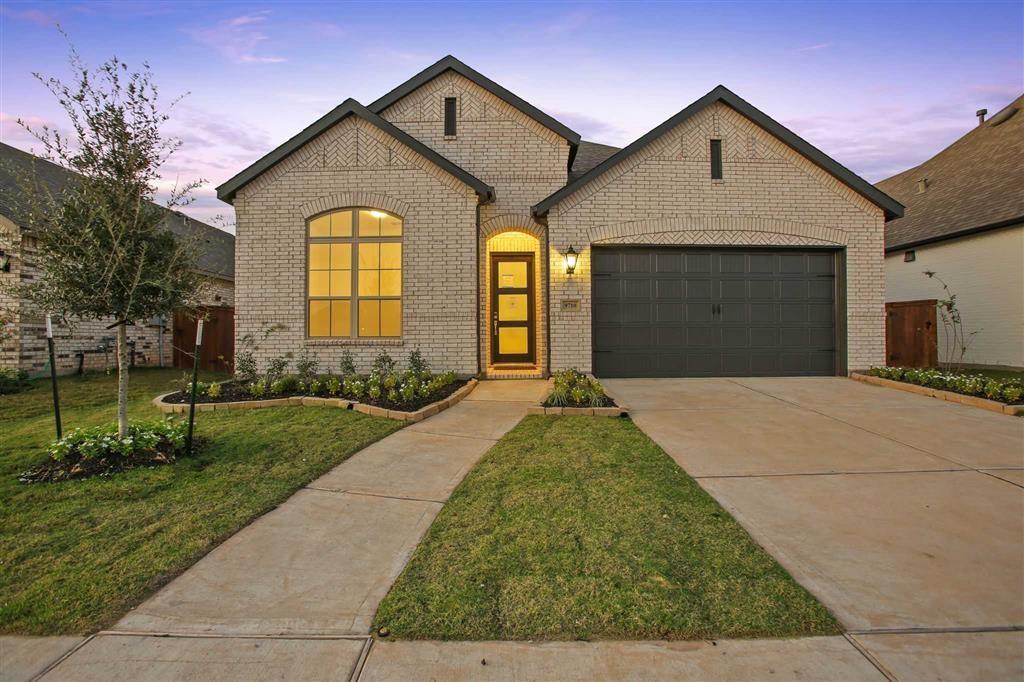 MLS# 49133224 - Built by Highland Homes - Ready Now! ~ Enjoy NO BACK NEIGHBORS on this property located in our gated section! Model Home Plan, The Denton, features everything you could want in a one story! Tall ceilings and natural light welcome you into the home. Kitchen area overlooks the family room and has PLENTY OF STORAGE & COUNTERTOP space. Features quartz countertops and built-in stainless steel appliances! Wood-look tile in all main living areas. Work from home comfortably in the study. Primary suite is a true retreat complete with large walk-in closet. Unwind on the TEXAS-SIZED covered patio! Backyard large enough for a pool. Community features on-site schools and amenities such as a 24hr fitness center, café, resort style pool, upcoming LAZY RIVER and more! Located only 10 min from shopping & dining in Pearland Town Center!