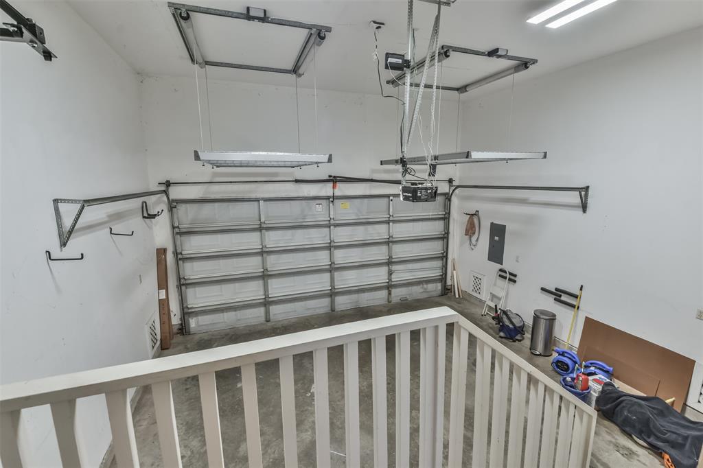 2 car garage.  This garage features two shelving lifts that are motorized and help with storage.